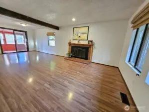 Large second living room with dining room that flows into the sun room.