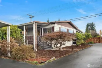 Covered front entry and covered deck off of family room.