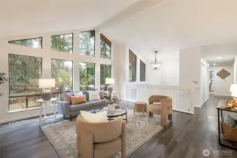 The vaulted ceiling just enhances those large front windows that allows in so much natural light.