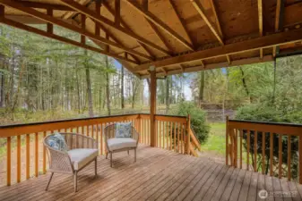 The covered back deck is a great place to enjoy fresh air no matter the season.