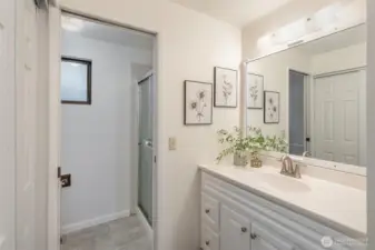 Additional closet space, updated vanity, and shower round out this space.