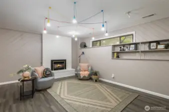 Downstairs - find a flexible bonus space with gas fireplace.