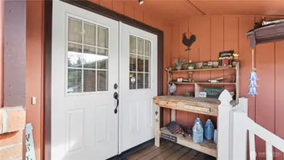 Cozy covered front porch and inviting double-door entry.