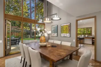 Harwood floors, high ceilings & double height windows make for a memorable, light-filled dining room.