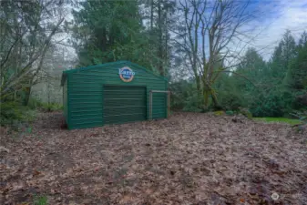 Exterior of shop.  Large roll up door for large projects or a stand alone door on back side.