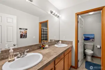 Full bath with double-sinks on upper level