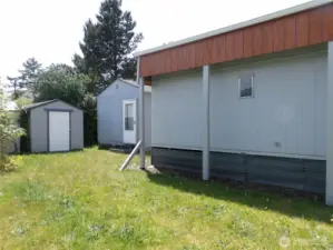Shed and cabin both have new roofs.  The cabin is roomy and can serve many purposes.  Here it is staged as a bunk house.