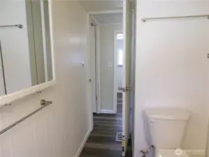 Leaving bathroom.  Go across hall to laundry room.