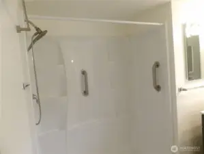 Shower has safety grab bars.
