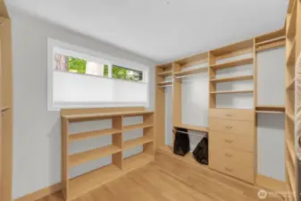 Primary bedroom walk in closet