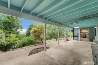 Exterior patio down with entry to workshop.