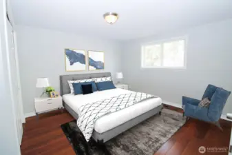 Primary bedroom has plenty of room for a large bed