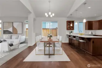 Virtually staged photo to showcase the open concept kitchen, dining and living room