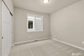 Adjacent to full bathroom is the second bedroom featuring a large reach-in closet.