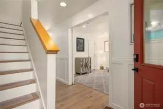 The lower level features a large bonus room with french sliding doors and can be used as an extra bedroom or home office.  This room also features a 3/4 bath, a large closet and charming wainscot detail.