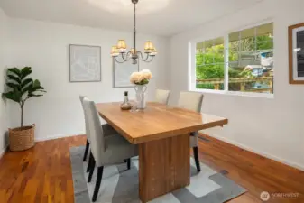 The dining room is located just off the kitchen and looks over front yard.