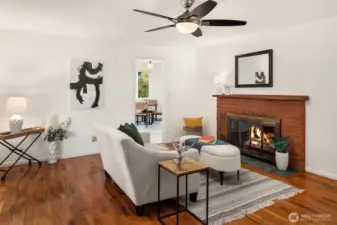 Family room with wood burning fireplace.