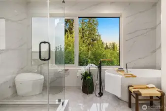 Serene spa retreat with a freestanding soaking tub, glass-enclosed shower, and lush treetop views