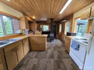 Double sink, stove/range, fridge & microwave stay.