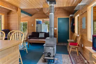 Nice shot showing the free standing woodstove that is the heart of the home.