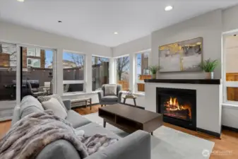 Open living w/ beautiful windows, gas fireplace and easy access to front patio