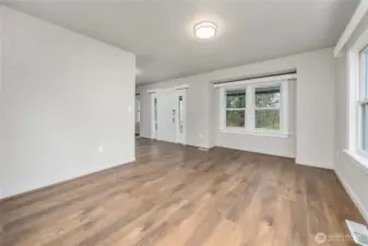 Dining room and front door from the entry to the kitchen.