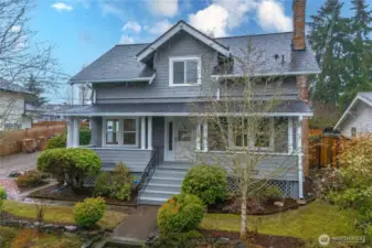 Covered front porch is inviting and offers protection from the rain. NEW roof!