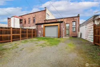 Fenced in back portion of property