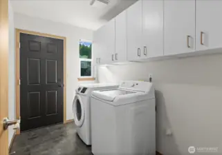 Laundry room with tons of storage.