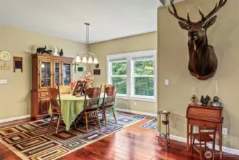 Oversized dining room with natural light and door to covered patio...