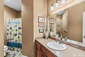 Generous sized main bath with tub/shower, comfort height vanity and plenty of counter space.