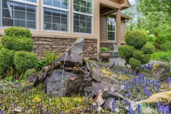 Enjoy the pond with water feature and easy-care landscape as it trickles outside the office window...