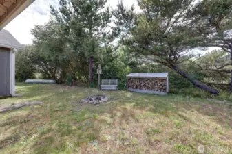 Back yard, wood storage and access to the canal.