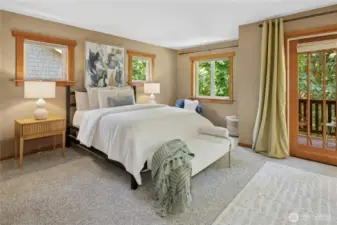 Spacious Primary Bedroom with lots of fir wrapped windows.