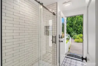 3/4 bath on main, leads out back - perfect for a post-pool rinse!