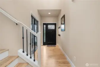 Another view of the entryway, with the office/den featuring French doors in the back left corner.