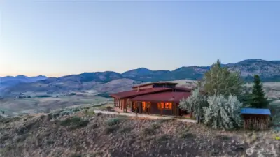 Welcome to Hilltop, a 3600 square-foot masterpiece perched above the valley on 40 private acres with unique access through Pearrygin Lake State Park.