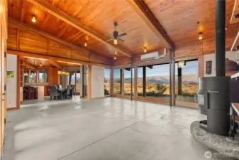 The living area connects directly to the kitchen and dining area. This space truly comes alive after dark, with the soft lighting bringing out the warmth of all the reclaimed Douglas-fir finish work.