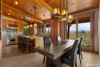 This generous dining nook is large enough for a table to sit up to 8. Another sliding door allows you to bring the sounds of nature in.