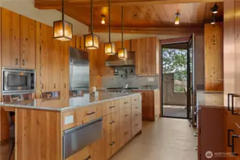 Covered patio off the kitchen for dining al fresco and grilling in all seasons.