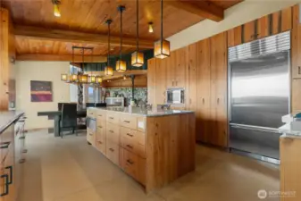The kitchen appliances include a Viking range/oven, Sub-Zero fridge/freezer, and Bosch dishwasher as well as built-in warming drawer, wine cooler and convection microwave.