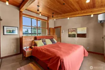 Primary bedroom with windows paired through the hallway to allow in the morning light. Built in bed complete with night stands and separate switches for dedicated reading lights.
