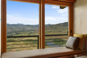 A window seat with views of Pearrygin Lake and Isabella Ridge, complete with a sliding door to let in cooling breezes and birdsong.