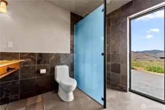 Beautiful and functional 3/4 bath with exterior access - there is an outdoor shower just around the corner on the cement patio, and the hot tub is just a few steps beyond.