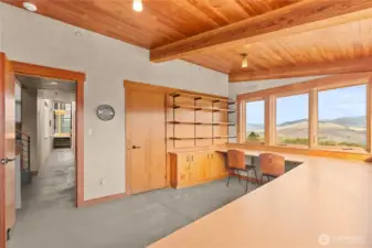 The larger of the two offices, this space has plenty of storage and work space, wrap-around views, and a built-in yoga wall just out of the frame to the left. As with the other office, this too can be repurposed as a bedroom as was originally envisioned in the architectural drawings.