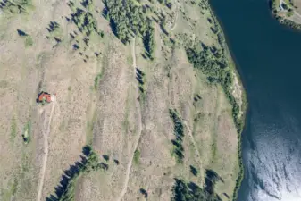 From high above, looking down on Hilltop; see the access road through state park land, part of the trail system around the lake, and Pearrygin Lake itself - a popular summer destination!