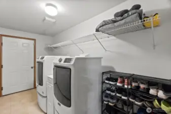 Super large laundry room lead to the attached two car garage.