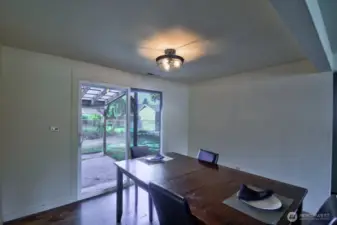 Large dining space with slider to the backyard.