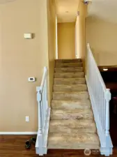 stairs to up level with 2 bedrooms and 2 full baths