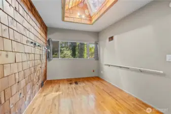 Bedroom with walk in closet and skylight